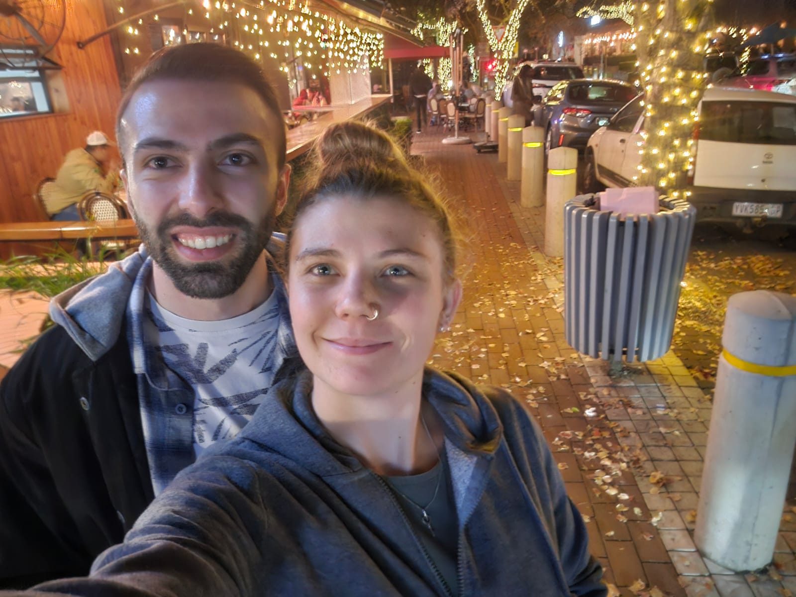 Rui and Cailyn under fairy lights in Hazelwood